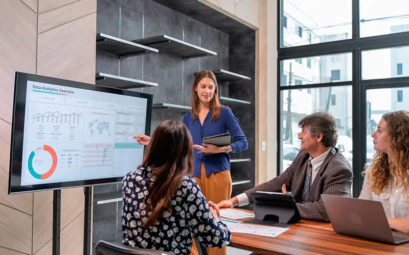 Photo of a woman showing the impact of leadership development with data analytics.